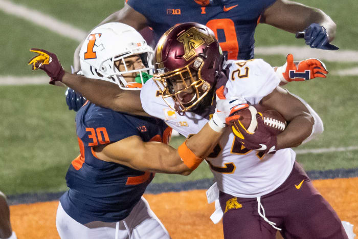 Minnesota Golden Gophers running back Mohamed Ibrahim (24) runs the ball against Illinois Fighting Illini defensive back Sydney Brown (30) during the second half at Memorial Stadium.
